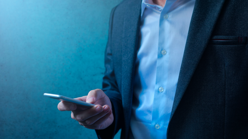 Email Campaign. Men holding mobile phone to read the news.